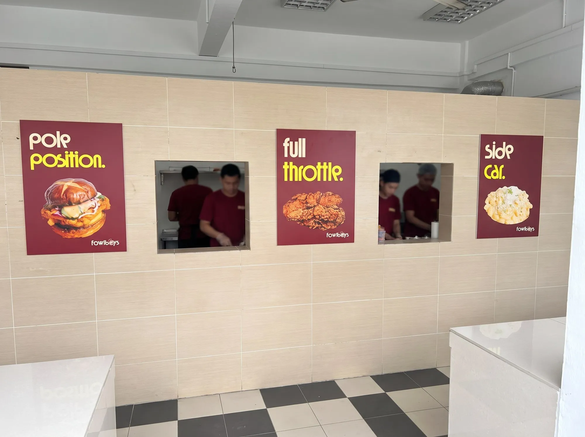 Three posters on the kiosk's back wall, pole position, full throttle and side car